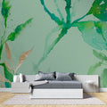 Green and gold watercolor wallpaper in modern living room creating a sophisticated atmosphere