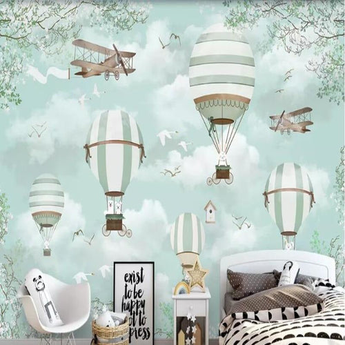 Vintage airplane wallpaper bringing charm to a child's playroom with mint green accents