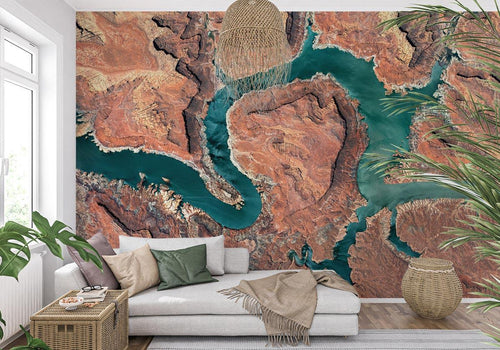 Aerial Nature Wallpaper showcasing turquoise river through desert canyon in modern living room with grey sofa