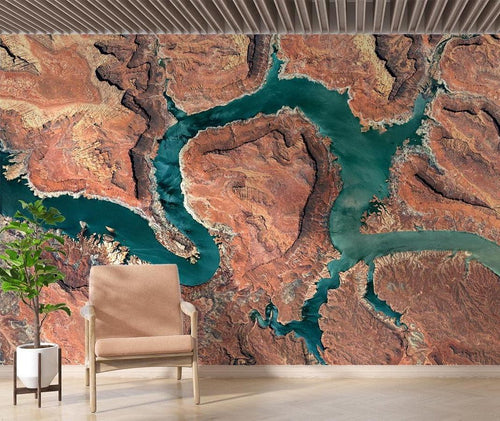 Canyon landscape wallpaper with aerial river view displayed in minimal office space with wooden desk