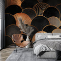 Art deco black and gold wallpaper in modern living room with grey sofa and brass accents