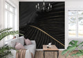 Black and gold art deco wallpaper creating drama in a modern living room setting