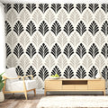 Art deco fan pattern wallpaper adding glamour to a modern dining room with black furniture and crystal chandelier