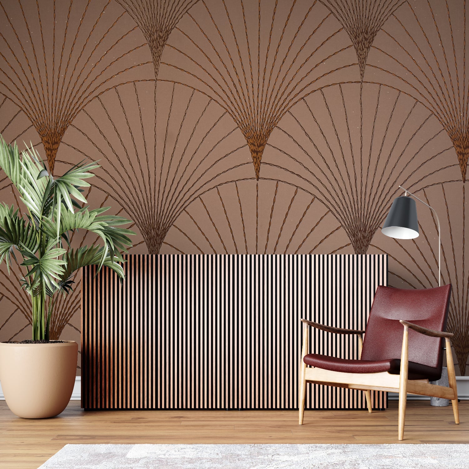 Art deco wallpaper featuring fan motifs in a home office with brass desk accessories
