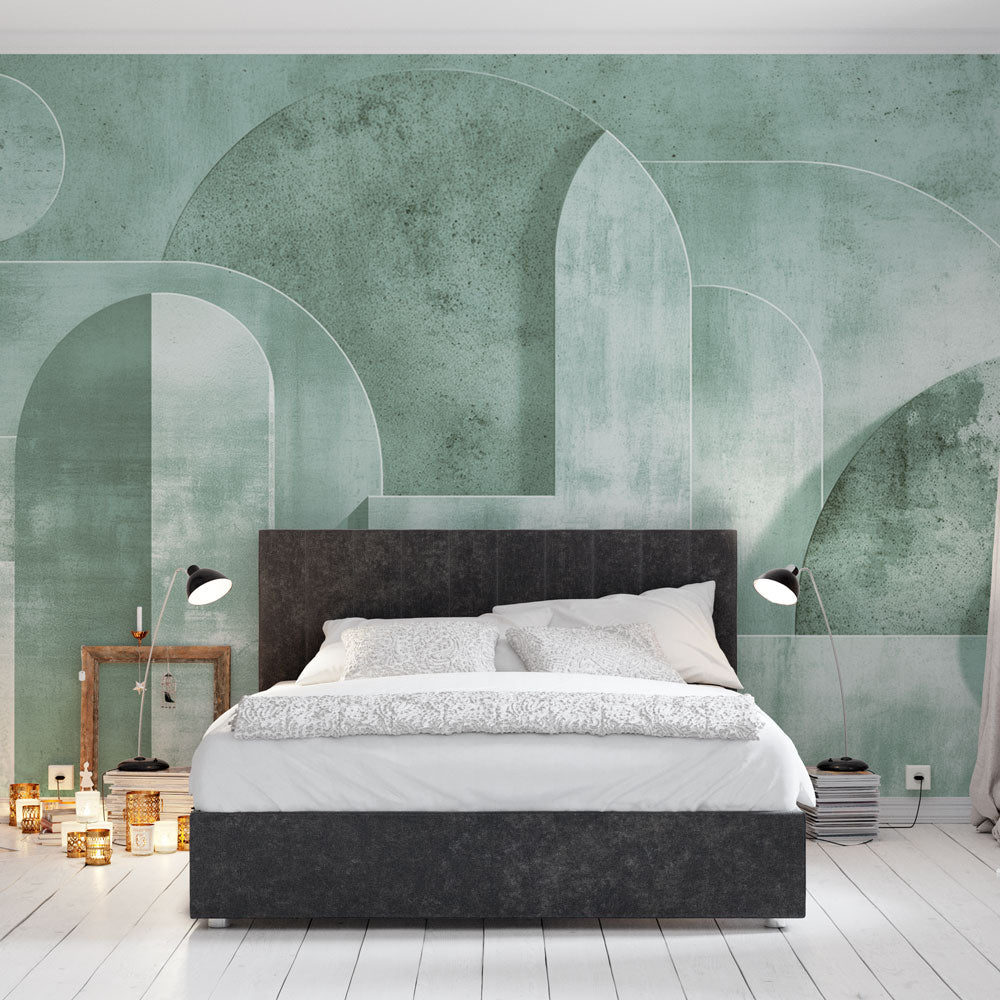 Art deco geometric wallpaper in green tones creating an elegant backdrop in a modern living room with minimal furniture