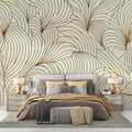 Art deco feather wallpaper in gold and beige creates a stunning backdrop in an elegant dining room with modern furniture