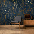 Art deco gold wave wallpaper in modern dining room with crystal chandelier and navy accents
