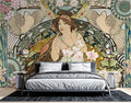 Art Nouveau goddess wallpaper mural in a bright dining room with crystal chandelier and vintage furniture