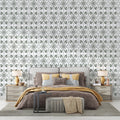 Art Nouveau green floral wallpaper in a bright modern living room showing geometric pattern detail