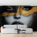 Black and gold portrait wallpaper making a bold statement in a modern living room with minimal furniture