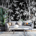 Black and white bamboo forest wallpaper creating depth in a modern minimalist living room with clean lines and natural light