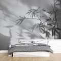 Bamboo shadow wallpaper creating a serene atmosphere in a modern minimalist living room with natural light
