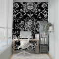 Black and silver baroque wallpaper in elegant living room with high ceilings