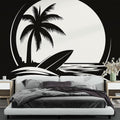 Black and white beach mural wallpaper creating a modern coastal feel in a minimalist living room with clean furniture lines