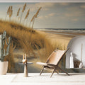 Coastal beach wallpaper with golden dunes creating a serene atmosphere in a modern living room with natural light