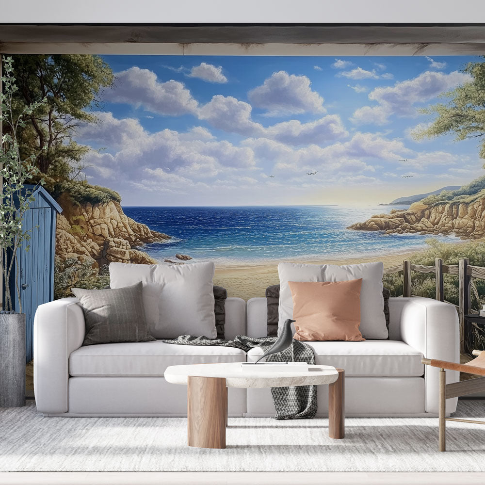 Beach scene wallpaper creating a sunny coastal atmosphere in a modern living room with white furniture