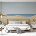 Beach wallpaper mural shown in modern living room, highlighting the minimalist coastal dunes design against white furniture