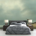 Beach scene wallpaper with lifeguard tower shown in a bright living room with coastal decor and natural light
