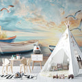 Beach mural wallpaper creating a coastal vibe in modern living room with gray sofa