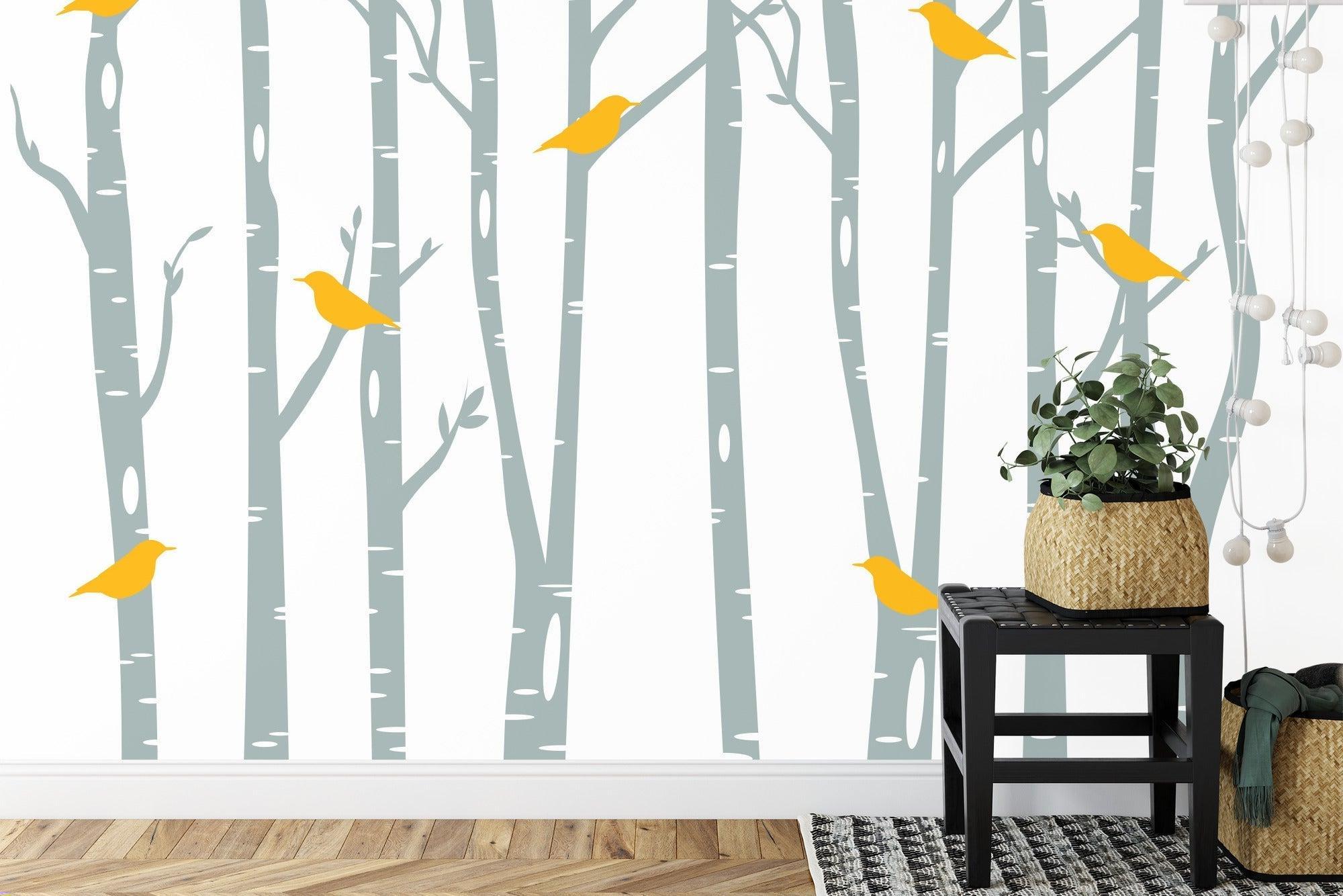 Birch forest wallpaper with yellow birds in a bright Scandinavian living room setting