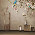Birds and magnolia wallpaper in a bright dining room with natural light showing blue birds in flight