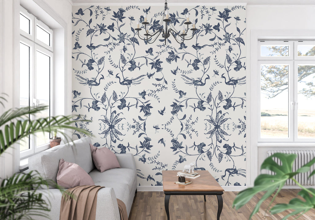 Blue and white bird wallpaper in a cozy reading nook with window seat