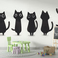 Black cat wallpaper mural styled in a modern Scandinavian living room, showing clean minimalist design impact