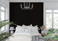 Black geometric wallpaper in modern living room creating dramatic accent wall