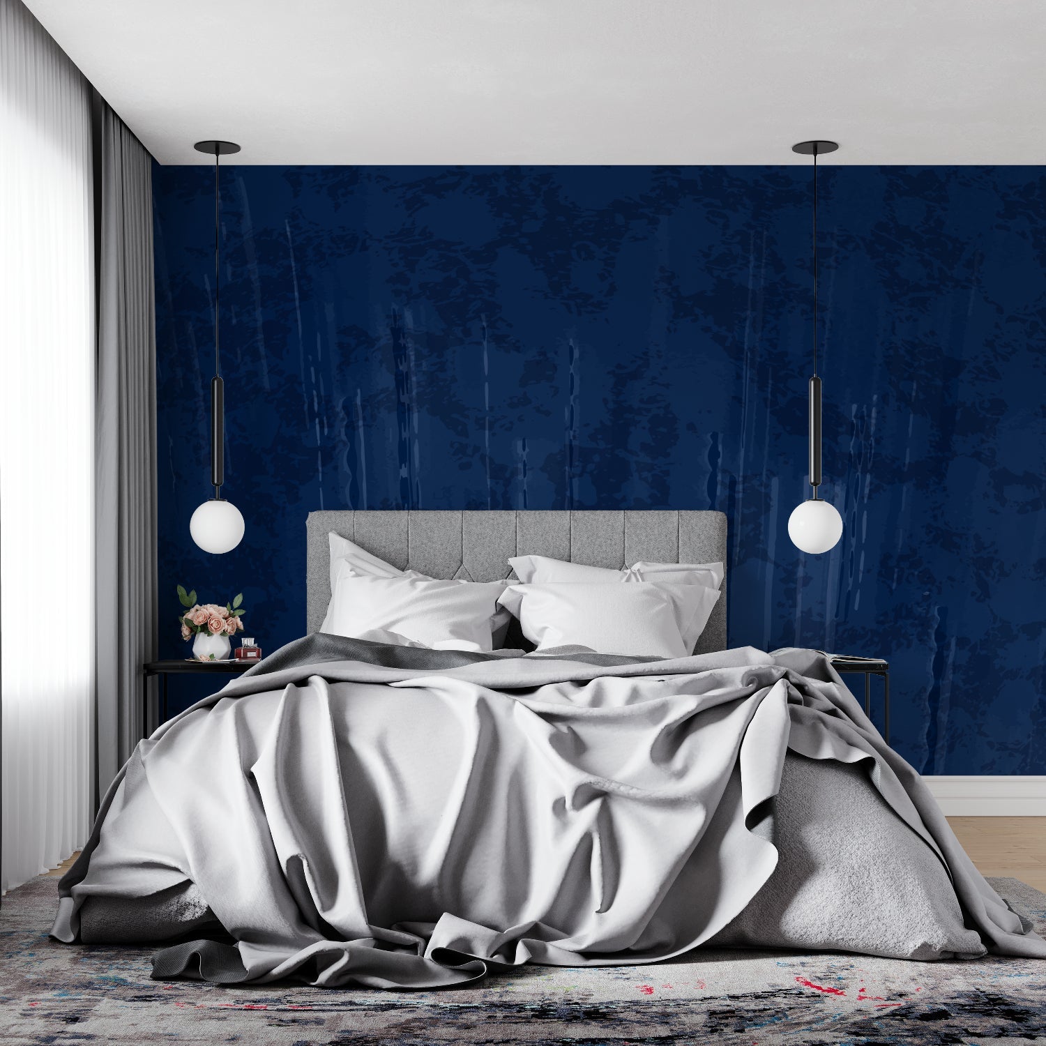 Navy textured wallpaper in master bedroom with white bedding and brass accents