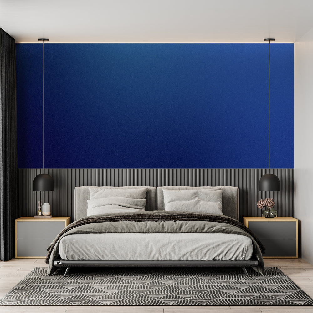 Modern blue and gold wave wallpaper in a bright living room with contemporary furniture