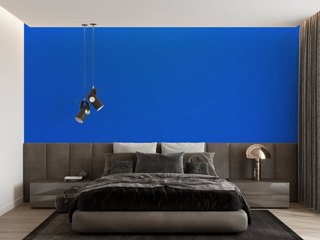 Modern electric blue wallpaper mural showcased in a minimalist living room with white furniture