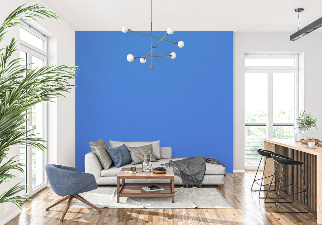 Electric blue wall mural creating drama in an urban dining room setting