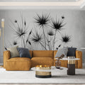 Black Yucca botanical wallpaper creating striking contrast in modern living room with minimal furniture