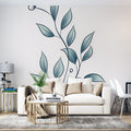 Botanical wall mural with minimalist blue leaves creating a serene atmosphere in a modern living room setting