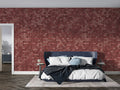 Red brick wallpaper creating industrial charm in modern living room with grey sofa and plants