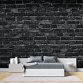 Black brick wallpaper in modern living room with grey sofa and industrial lighting