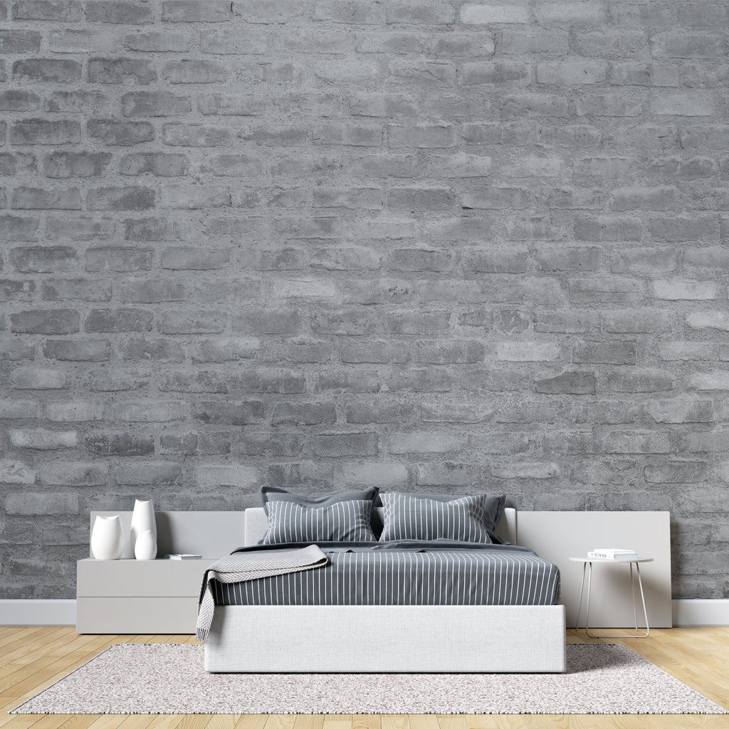 Grey brick wallpaper in modern minimalist living room with leather sofa and industrial lighting