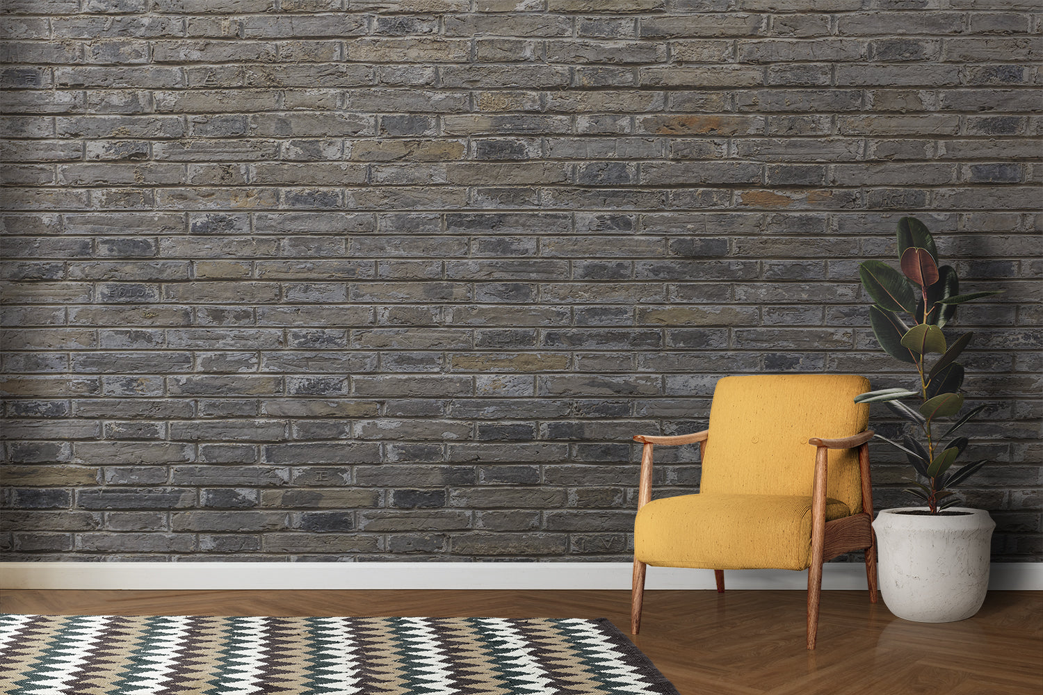 Grey brick wall mural in industrial kitchen with stainless steel appliances