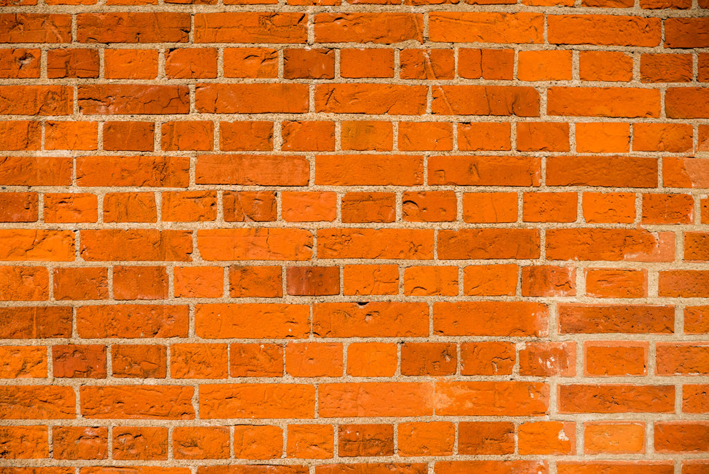 Design file of orange terracotta brick wallpaper showing detailed texture and mortar lines