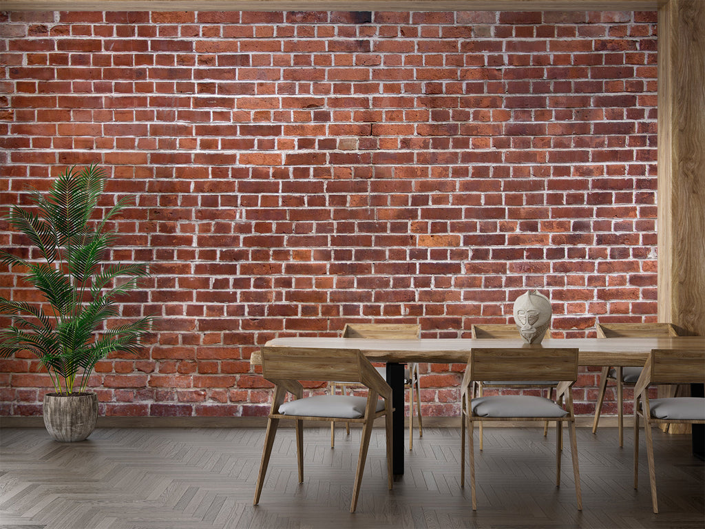 Red brick wall mural adding warmth to minimalist bedroom setting