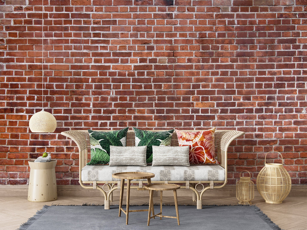 Rustic brick wall mural adding warmth to a minimalist dining space with pendant lighting