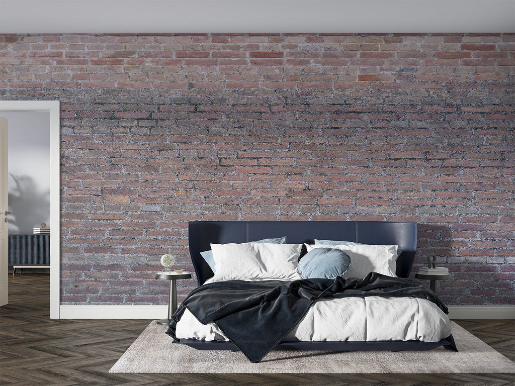 Brick effect wallpaper creating an industrial accent wall in a modern living room with leather furniture