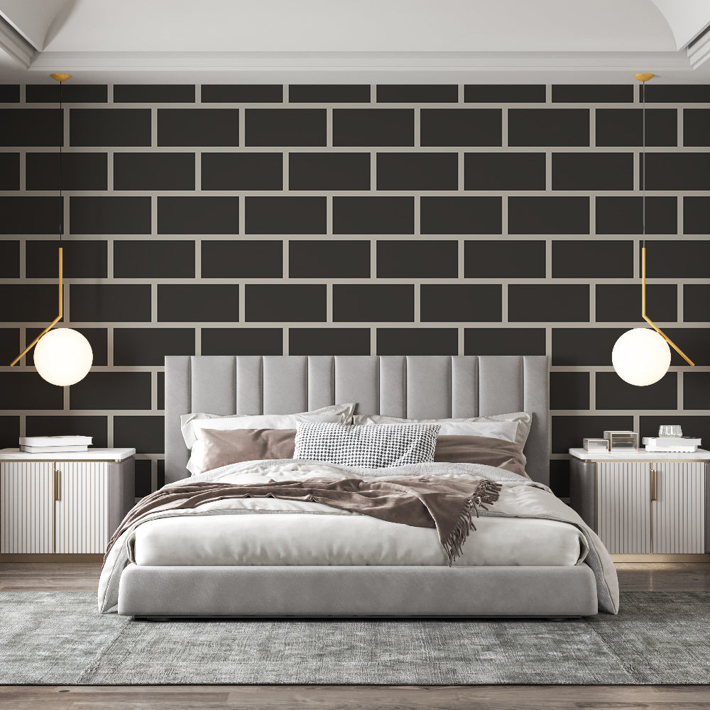 Modern black brick wallpaper creating a striking feature wall in a minimalist living room with grey sofa and metal accents