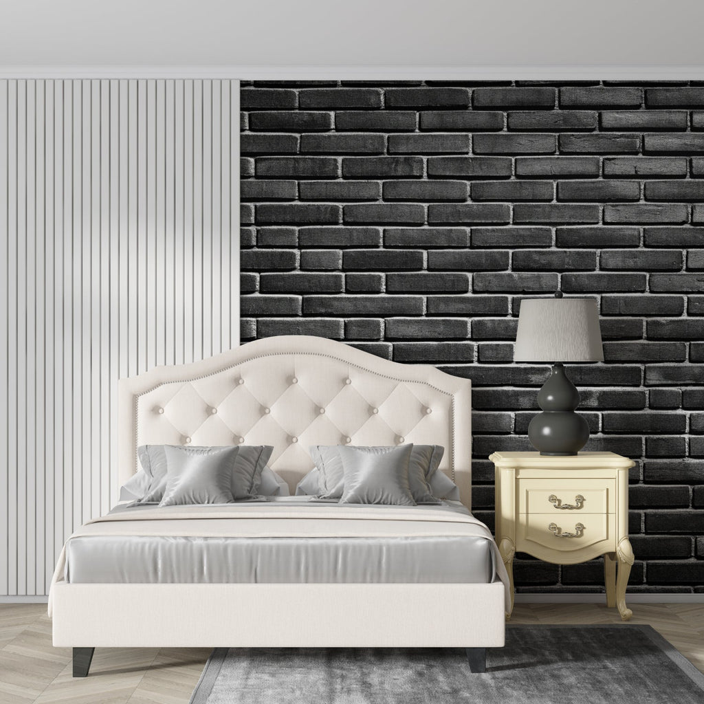 Black brick wallpaper in modern living room with grey sofa and industrial lighting