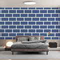 Modern blue brick pattern wallpaper in a bright living room with minimal furniture and large windows