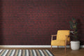 Red brick wallpaper creating industrial charm in modern living room with gray sofa and metal accents