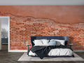 Brick wallpaper mural in modern living room showing terracotta tones and industrial charm