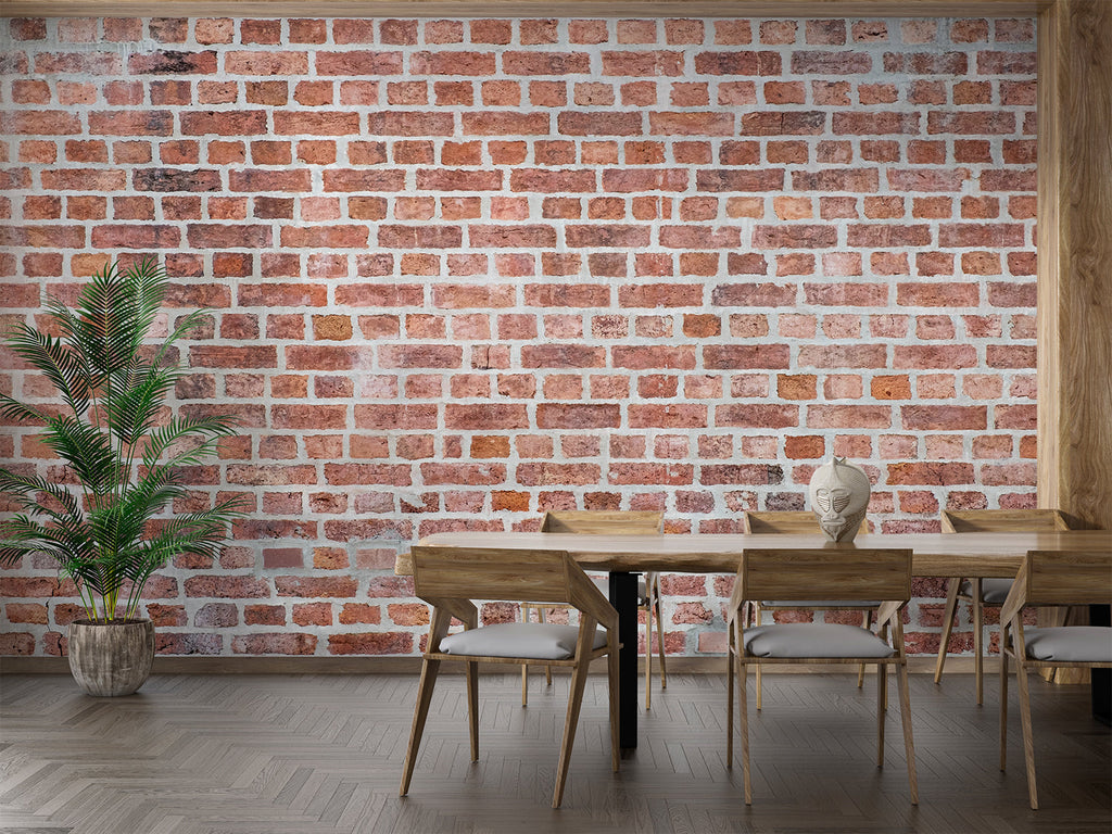 Vintage brick wallpaper creating an industrial feel in a modern living room with leather sofa