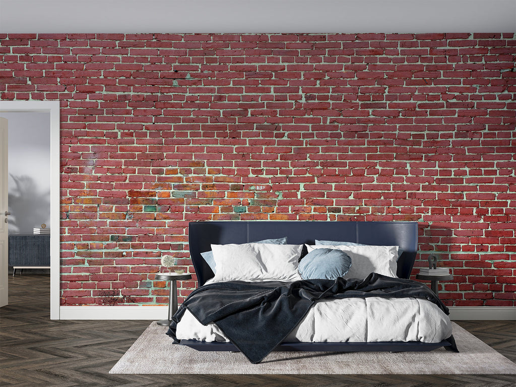 Red brick mural wallpaper in home office with metal desk and exposed beams