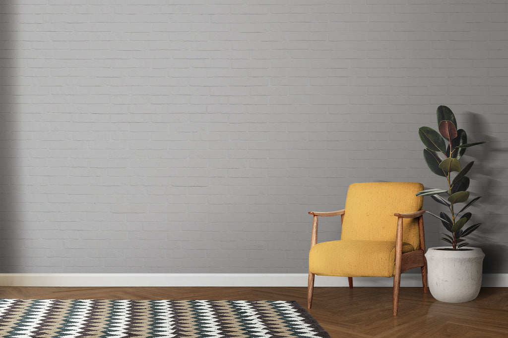 Modern office space featuring white brick wallpaper accent wall